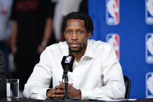 Patrick Beverley in a press conference, addressing serious legal charges and NBA reactions.