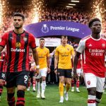Bournemouth and Arsenal players walk onto the pitch at the Vitality Stadium ahead of a Premier League match.