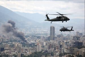U.S. military helicopters fly over Caracas as smoke rises from the city during reported strikes in Venezuela in January 2026.