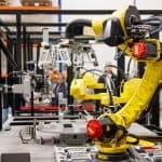 AI explained - industrial robot arm in manufacturing facility, physical AI and automation news today