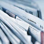 Today's top stories newspaper stack