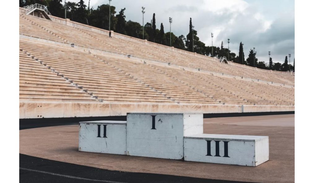 Numbered medal podium at a stadium, symbolizing the Commonwealth Games 2026 medal table led by Australia