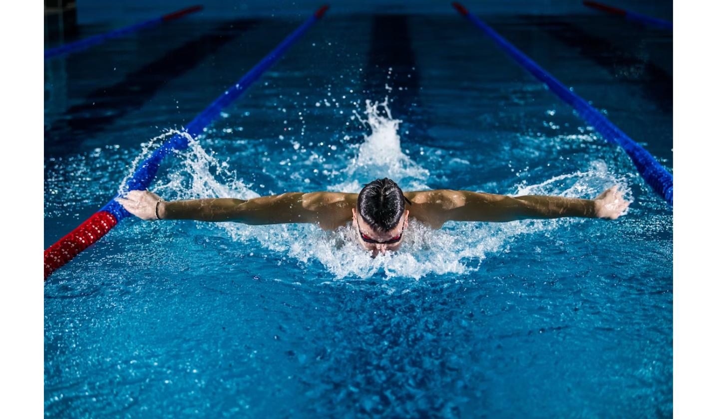 Swimmer competing in the pool at the Commonwealth Games 2026 in Glasgow, part of the medal-winning swimming program