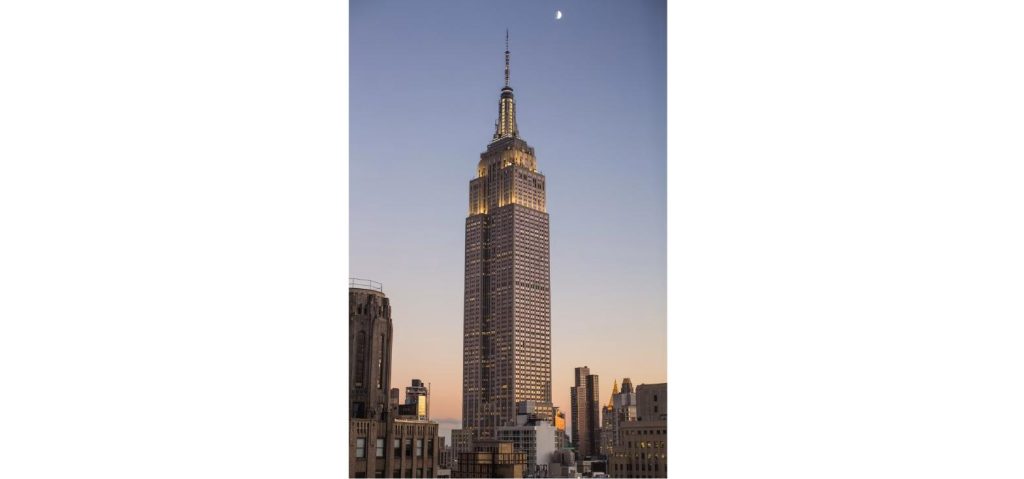 The Empire State Building at dusk in New York City, the backdrop of the viral rooftop proposal that sparked a wave of brand posts