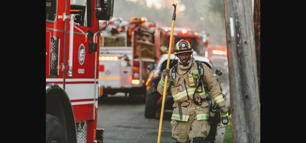 Firefighters and rescue vehicles responding after the Japan earthquake mall collapse