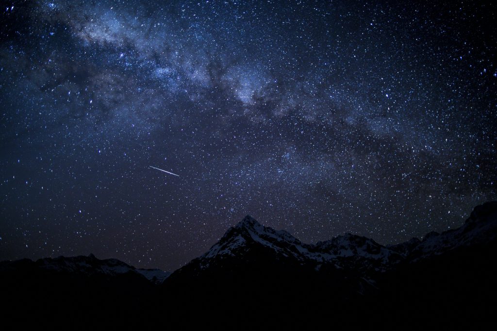 Perseid meteor shower 2026 streaking across the Milky Way over mountains