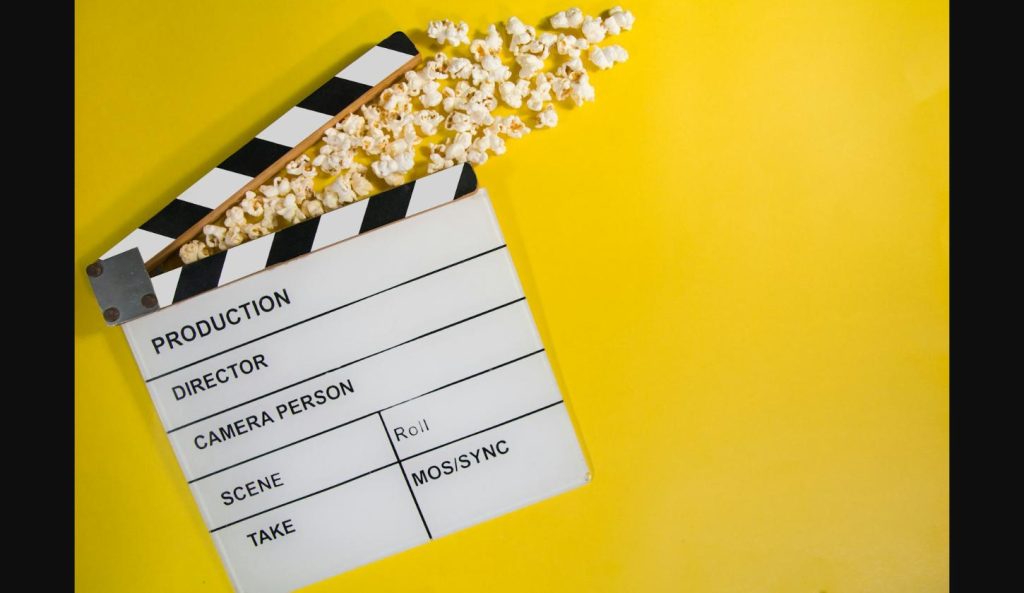 Movie clapperboard with popcorn, representing The Odyssey movie leak and its box office impact