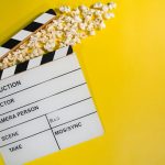 Movie clapperboard with popcorn, representing The Odyssey movie leak and its box office impact