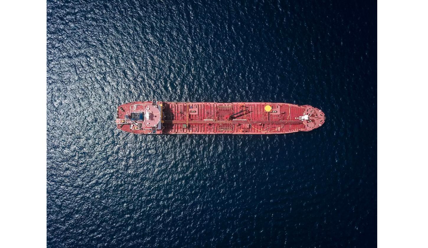 Aerial view of an oil tanker ship at sea amid rising crude oil prices
