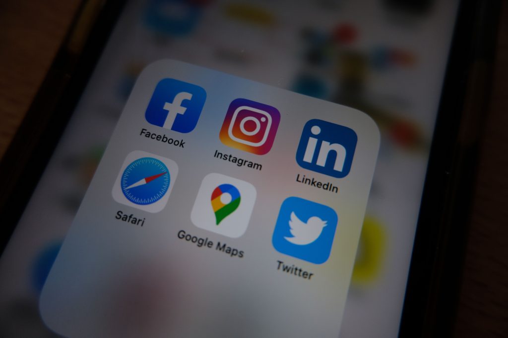 Close-up of a smartphone screen showing popular social media app icons