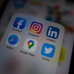 Close-up of a smartphone screen showing popular social media app icons