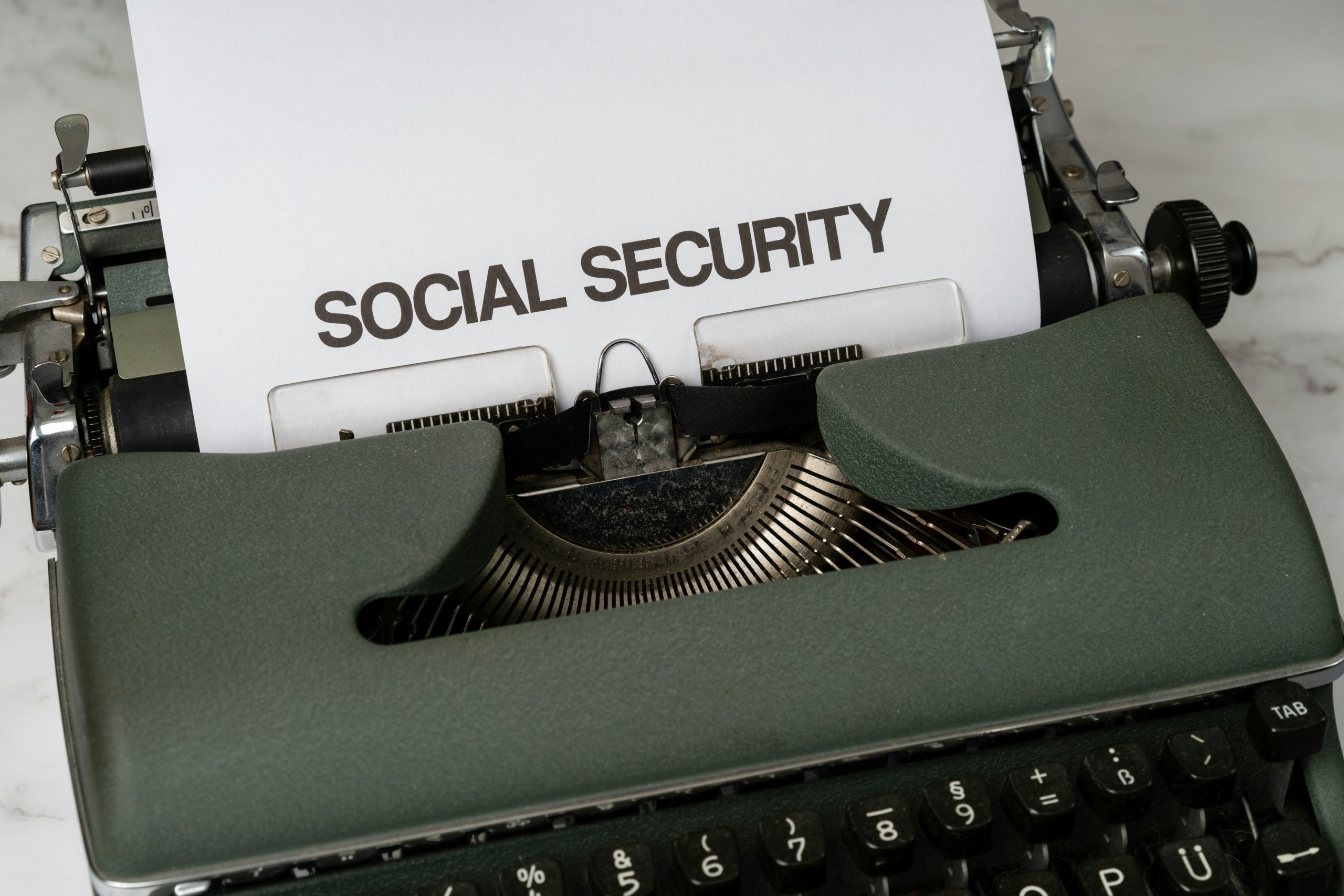 Social Security benefit cuts typewriter