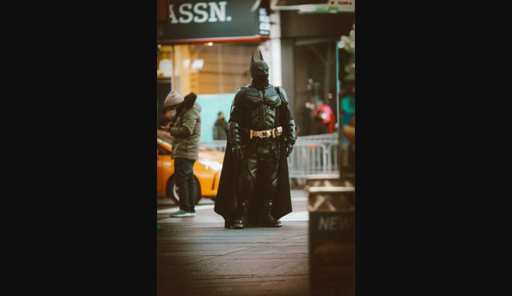 Superhero cosplayer dressed as Batman on the street outside Marvel Comic-Con 2026