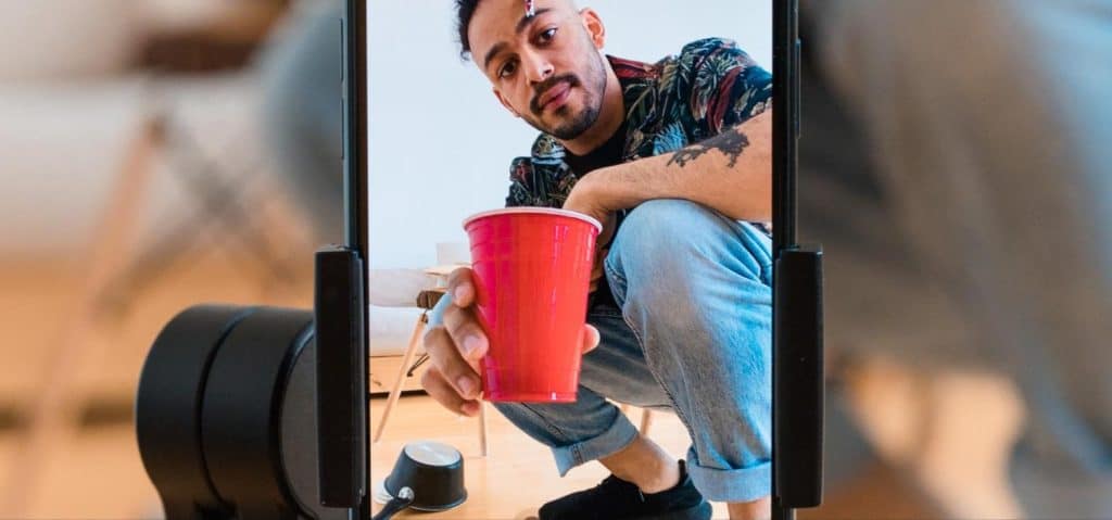 Viral trends right now - content creator filming a video on smartphone for social media