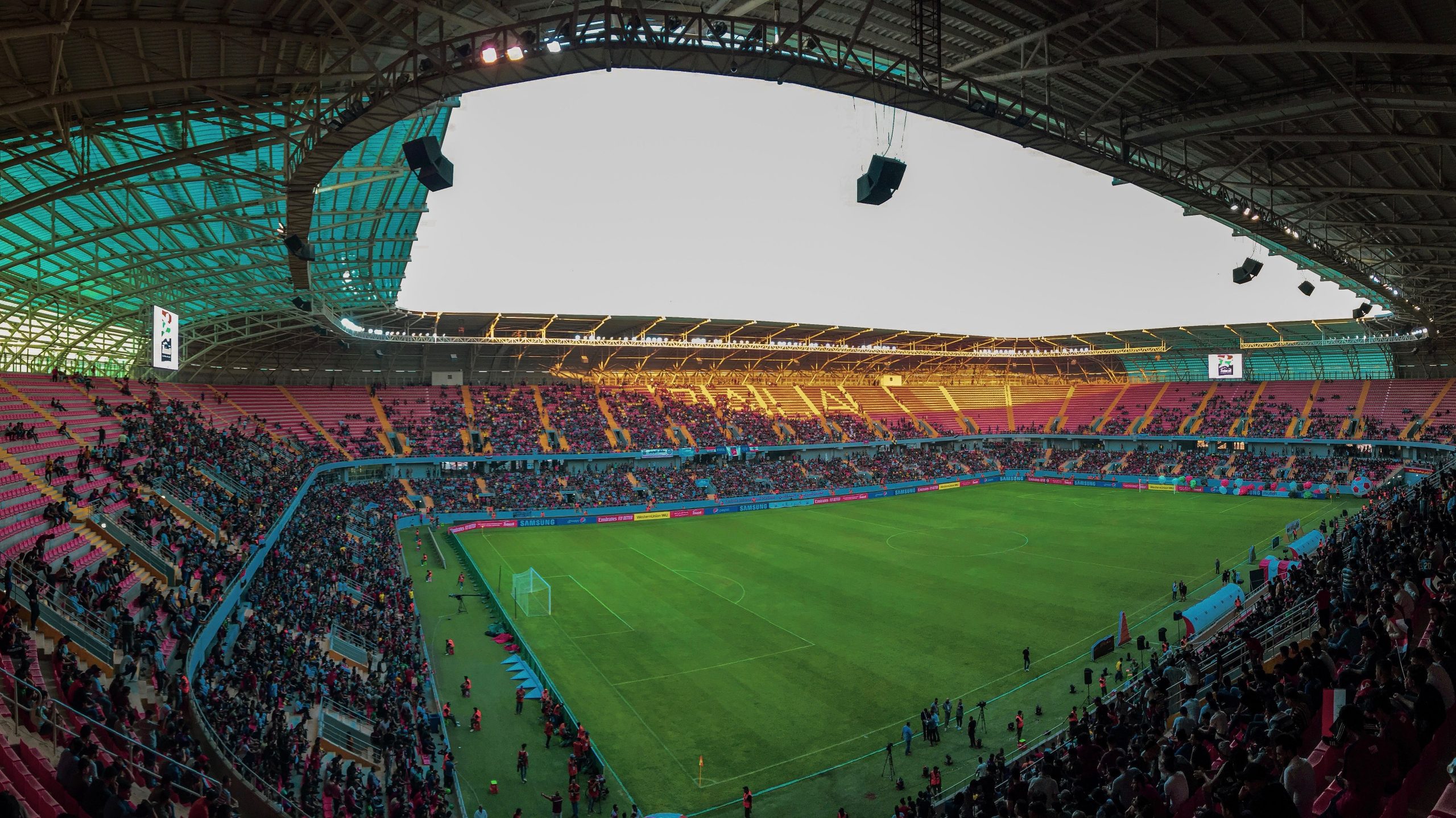 Panoramic view of a packed World Cup 2026 stadium crowd during a live match