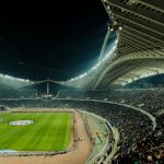 World Cup 2026 knockout stage match under stadium lights at night with a packed crowd