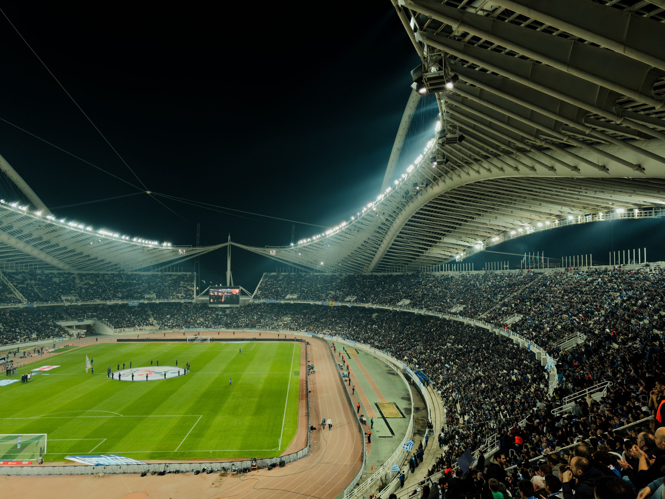 World Cup 2026 knockout stage match under stadium lights at night with a packed crowd