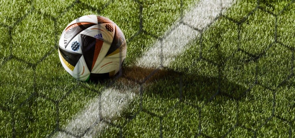 World Cup 2026 technology - the Adidas Trionda smart ball on the pitch behind the goal net