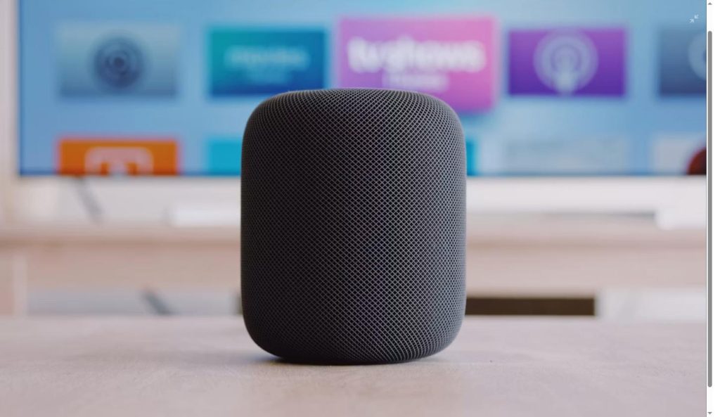 OpenAI's new AI speaker illustrated with a representative cylindrical smart speaker on display