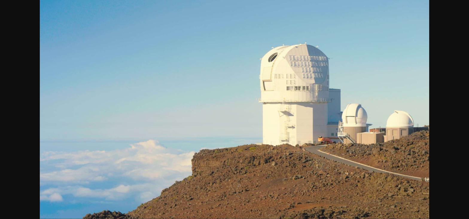 A large astronomical telescope observatory at dusk, representing today's trending stories about space telescope discoveries