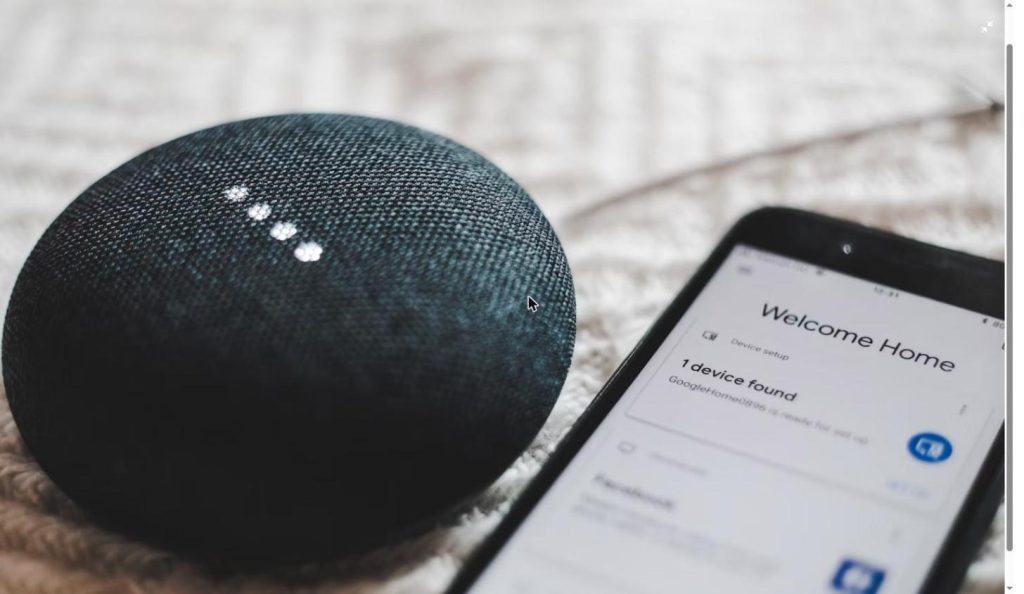 Illustrative photo of a round smart speaker, representing the shape of OpenAI's rumored AI speaker