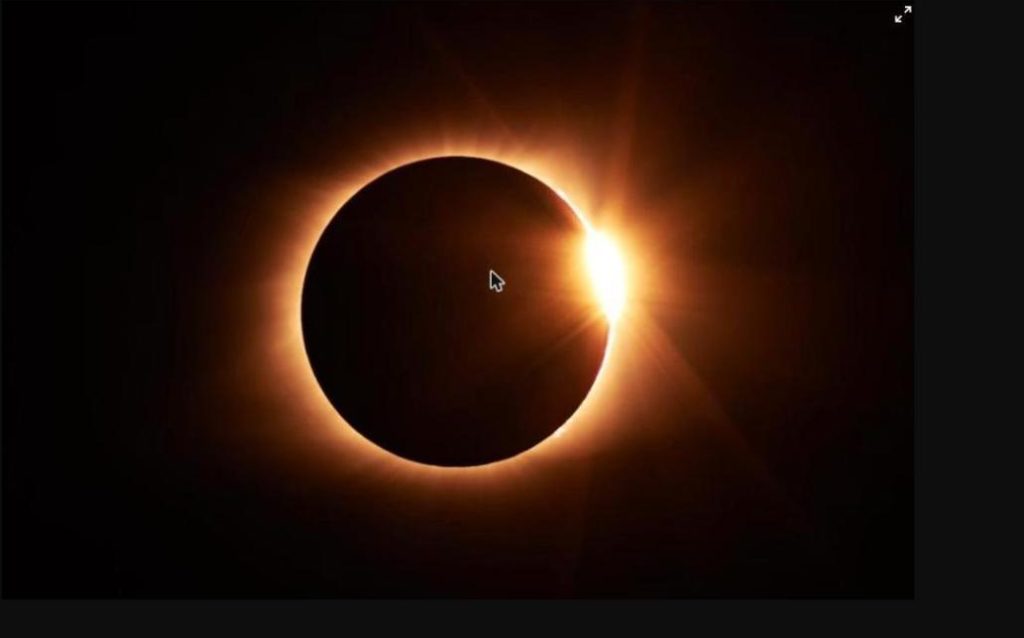 Total solar eclipse 2026 diamond ring effect with bright corona around the moon